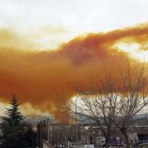 Orange toxic cloud is seen over the town of Igualada, near Barcelona, following an explosion in a chemical plant